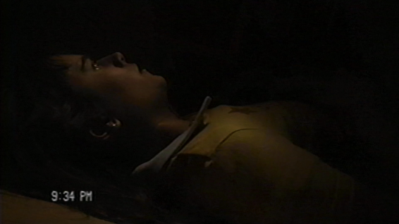Lily (Ally Ioannides) inside the coffin in "Suicide Bid"
